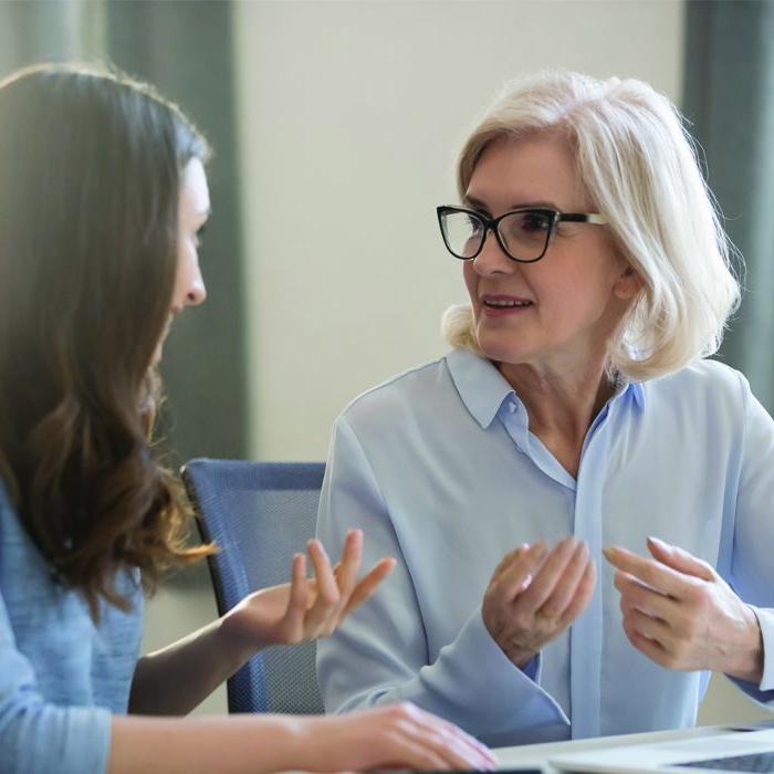 A woman discusses BALANCE financial counseling with her mother.